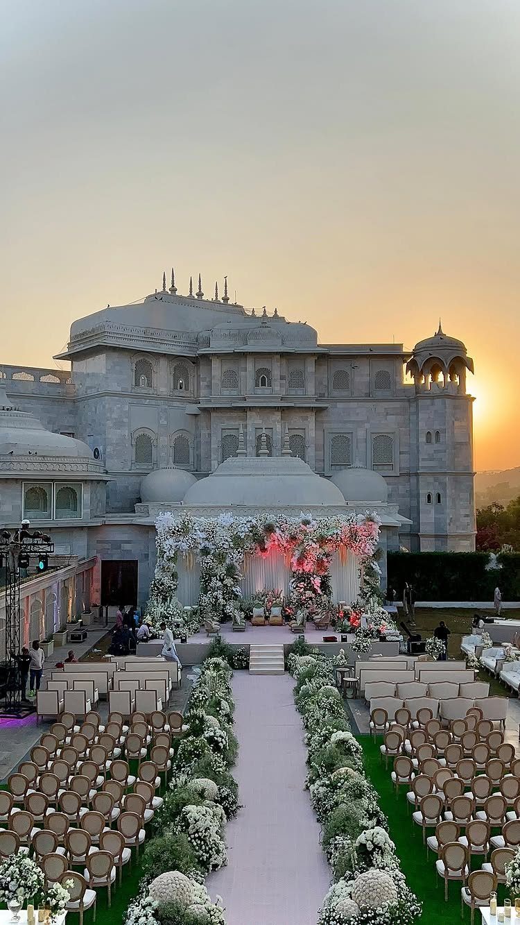 12 Wedding Events Ideas for Your Reception, Ceremony & More 6 White floral wedding aisle leading to a decorated altar in front of a large palace.