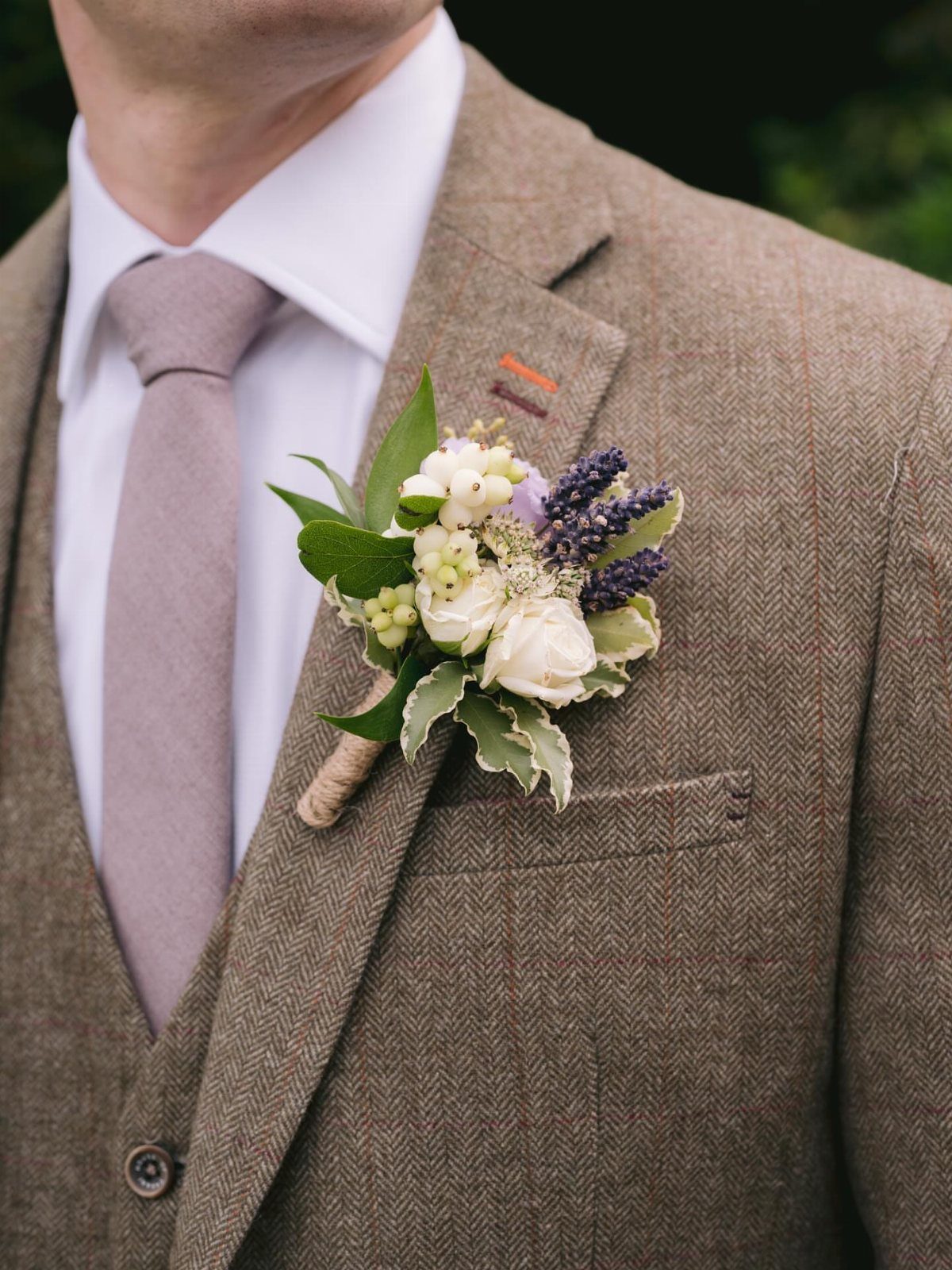Wildflower Wedding Theme: 13 Ideas for a Light, Natural Day 10 Man in a brown tweed suit with a floral boutonniere and mauve tie.